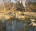 Aging sewer lines and erosion of stream banks contribute to water pollution in cities.